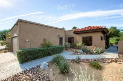 a home in a desert area with a building at Country Club Home 2 BR, 2 BA and Den about 1 Mi to Golf in Borrego Springs