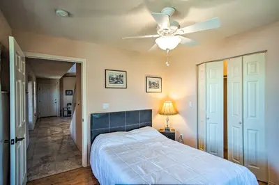a bedroom with a bed and a ceiling fan at Borrego Springs Home with Desert and Mountain Views! in Borrego Springs