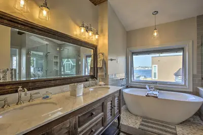 a bathroom with two sinks and a tub and a large mirror at San Diego Home - Walk to Sail Bay and Mission Beach! in San Diego