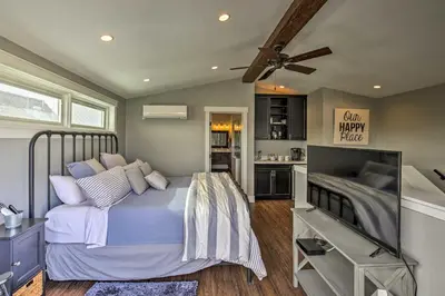 a bedroom with a bed and a flat screen tv at San Diego Home - Walk to Sail Bay and Mission Beach! in San Diego