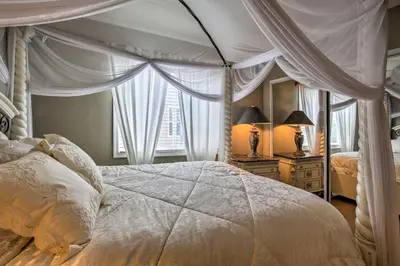 a bedroom with a canopy bed and a window at Luxe San Diego Getaway with Pool and Ocean Views in San Diego