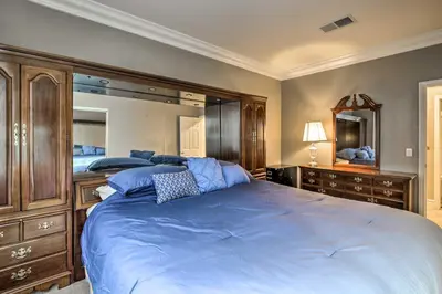 a bedroom with a large bed and a large mirror at Luxe San Diego Getaway with Pool and Ocean Views in San Diego