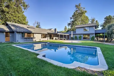 a house with a swimming pool in the yard at Family Retreat - Private Tennis Court and Game Room in Valley Center