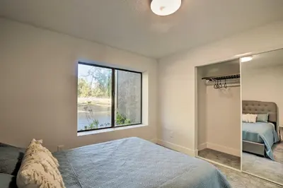 a bedroom with a bed and a window at Family Retreat - Private Tennis Court and Game Room in Valley Center