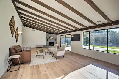 a living room with a couch and a table at Family Retreat - Private Tennis Court and Game Room in Valley Center