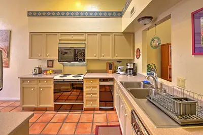 a kitchen with a sink and a stove top oven at Borrego Springs Condo with Private Patio and Views! in Borrego Springs