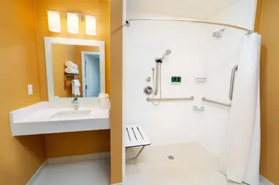 a bathroom with a sink and a shower at TownePlace Suites Irvine Lake Forest in Lake Forest