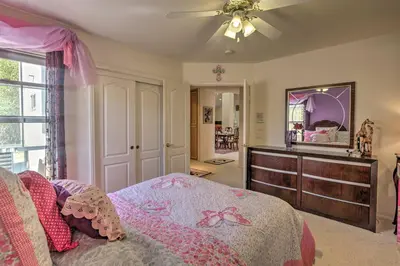 a bedroom with a bed and a dresser and a mirror at El Cajon Home with Pool, Grill Station and Decks in El Cajon