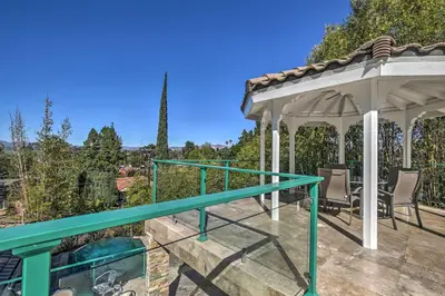 a gazebo with a table and chairs on a patio at El Cajon Home with Pool, Grill Station and Decks in El Cajon