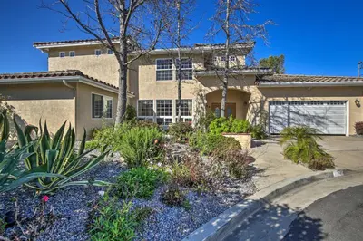 a house with a landscaping in front of it at El Cajon Home with Pool, Grill Station and Decks in El Cajon