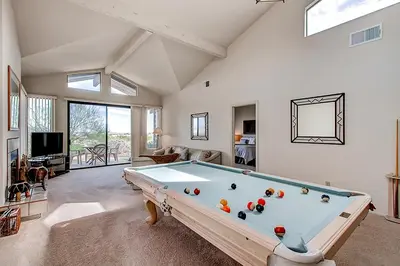 a large living room with a pool table at Borrego Springs Hideaway Pool Table, Mtn Views! in Borrego Springs