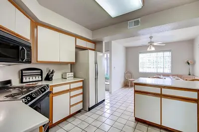 a kitchen with a stove and a refrigerator at Borrego Springs Hideaway Pool Table, Mtn Views! in Borrego Springs