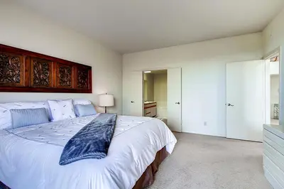 a bedroom with a large white bed in a room at Borrego Springs Hideaway Pool Table, Mtn Views! in Borrego Springs