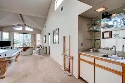 a large kitchen with a sink and a pool table at Borrego Springs Hideaway Pool Table, Mtn Views! in Borrego Springs