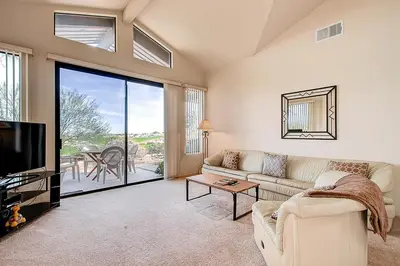 a living room with a couch and a tv at Borrego Springs Hideaway Pool Table, Mtn Views! in Borrego Springs