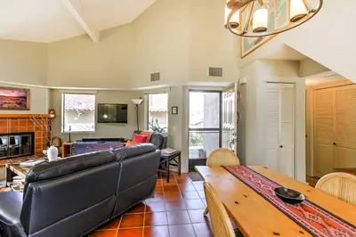 a living room with a couch and a table at Borrego Springs Condo with Private Hot Tub and Views! in Borrego Springs