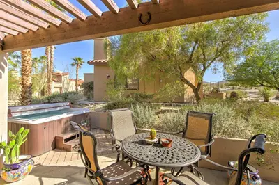 a patio with a table and chairs and a pool at Borrego Springs Condo with Private Hot Tub and Views! in Borrego Springs