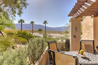 a table and chairs on a porch with a view of the desert at Borrego Springs Condo with Private Hot Tub and Views! in Borrego Springs