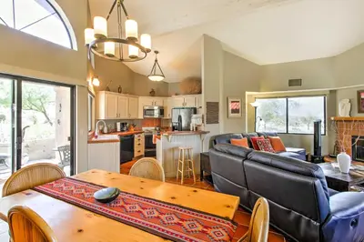 a living room with a couch and a table at Borrego Springs Condo with Private Hot Tub and Views! in Borrego Springs