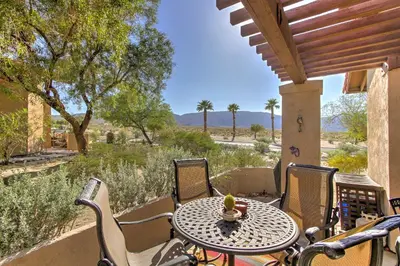 a table and chairs on a porch with a view of the desert at Borrego Springs Condo with Private Hot Tub and Views! in Borrego Springs