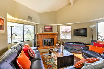 a living room with a couch and a fireplace at Borrego Springs Condo with Private Hot Tub and Views! in Borrego Springs