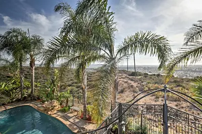 a resort with a pool and palm trees at Ocean-View San Diego Home with Pool, Patio and Hot Tub in San Diego