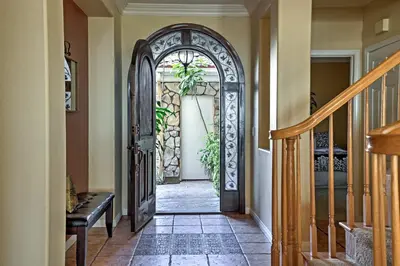 an entry door to a home with a plant at Ocean-View San Diego Home with Pool, Patio and Hot Tub in San Diego