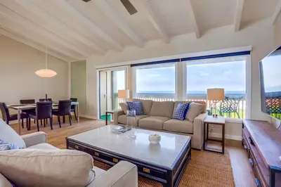 a living room with a couch and a table at Beach Access Oceanview SBTC331 Condo in Solana Beach