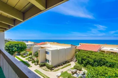 a view of a building from a balcony at Beach Access Oceanview SBTC331 Condo in Solana Beach