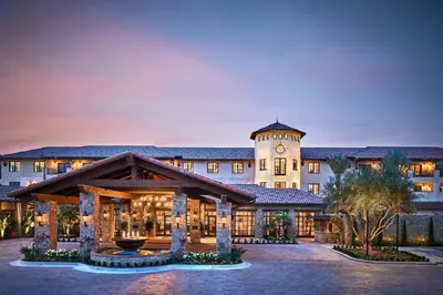 a building with a clock tower on top of it at Inn at the Mission San Juan Capistrano, Autograph Collection in San Juan Capistrano
