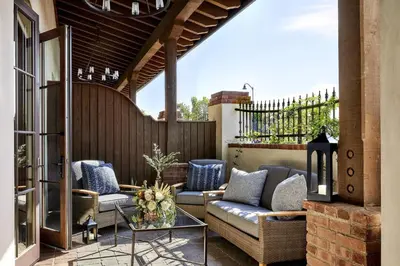 a patio with two couches and a table at Inn at the Mission San Juan Capistrano, Autograph Collection in San Juan Capistrano