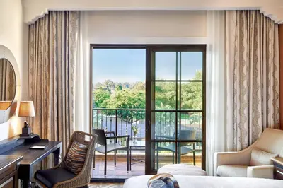 a hotel room with a view of a balcony at Inn at the Mission San Juan Capistrano, Autograph Collection in San Juan Capistrano