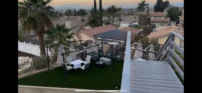 arial view of a balcony of a house with grass at Beautiful City Lights and Mountain Views in Menifee