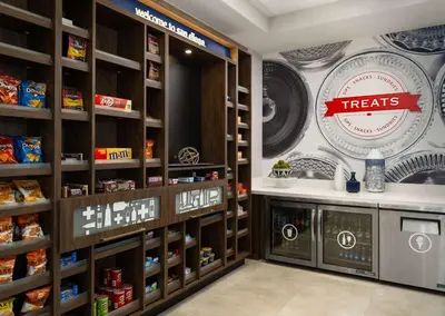 a grocery store with a treats sign on the wall at Hampton Inn & Suites El Cajon San Diego in El Cajon