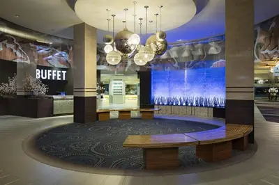 a lobby with a bench and a buffet in a store at Viejas Casino & Willows Hotel in Alpine