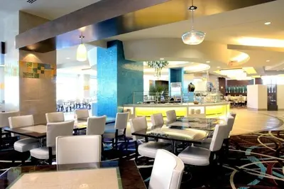 a restaurant with tables and chairs and a bar at Viejas Casino & Willows Hotel in Alpine