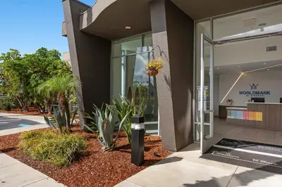 a building with plants in front of a building at Worldmark Oceanside Harbor in Oceanside