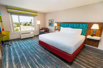a hotel room with a bed and a window at Hampton Inn & Suites Imperial Beach San Diego, Ca in Imperial Beach