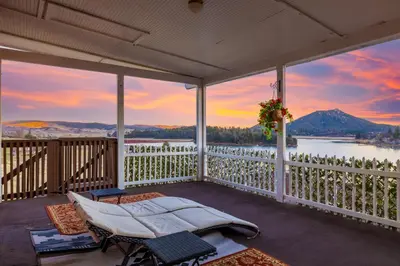 a porch with a bed and a view of a mountain at Quiet Mind Mountain Lodge, Retreat & Spa in Julian