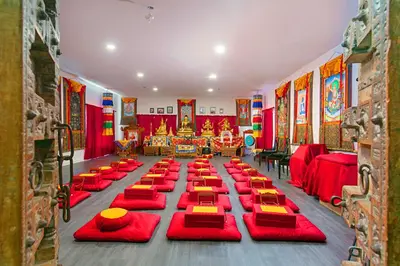 a large room with red tables and red chairs at Quiet Mind Mountain Lodge, Retreat & Spa in Julian