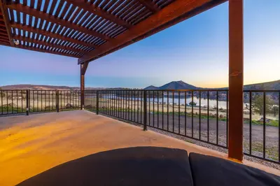 a view from the deck of a house with a couch at Quiet Mind Mountain Lodge, Retreat & Spa in Julian