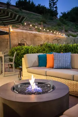 a fire pit in the middle of a patio at Ayres Hotel Vista Carlsbad in Vista