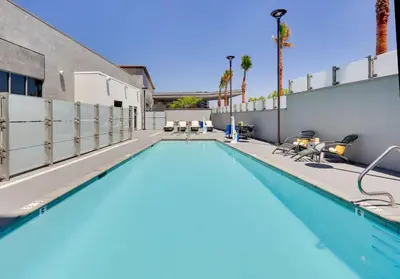 a swimming pool at a hotel with palm trees at Hampton Inn by Hilton Irvine Spectrum Lake Forest in Lake Forest