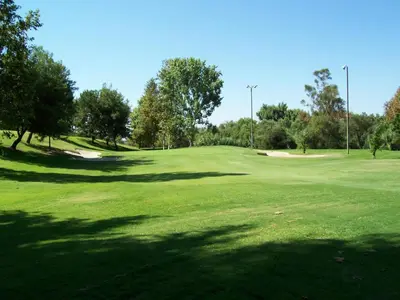 a golf course with trees and a green field at Hampton Inn by Hilton Irvine Spectrum Lake Forest in Lake Forest