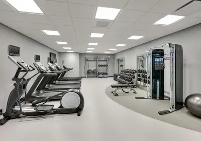 a gym with a row of treadmills and machines at Hampton Inn by Hilton Irvine Spectrum Lake Forest in Lake Forest