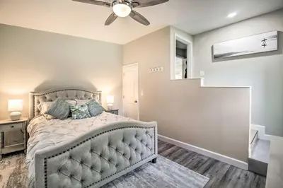 a bedroom with a bed and a ceiling fan at Coastal Carlsbad Home 1 Mi to Beach and Downtown in Carlsbad