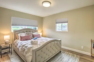 a bedroom with a large white bed with pillows at Coastal Carlsbad Home 1 Mi to Beach and Downtown in Carlsbad