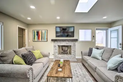 a living room with two couches and a fireplace at Coastal Carlsbad Home 1 Mi to Beach and Downtown in Carlsbad