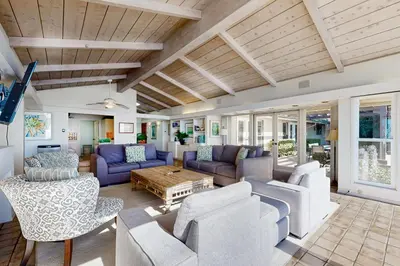 a living room with couches and a table at Forever Views in San Diego