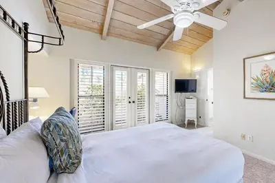 a bedroom with a bed and a ceiling fan at Forever Views in San Diego